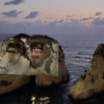 حزب الله يكسر قرار الحكومة بإضاءة صخرة الروشة بصور نصرالله وصفي الدين