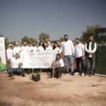 موظفو البنك الأردني الكويتي يشاركون في مبادرة القافلة الخضراء لزراعة الأشجار في محافظة جرش